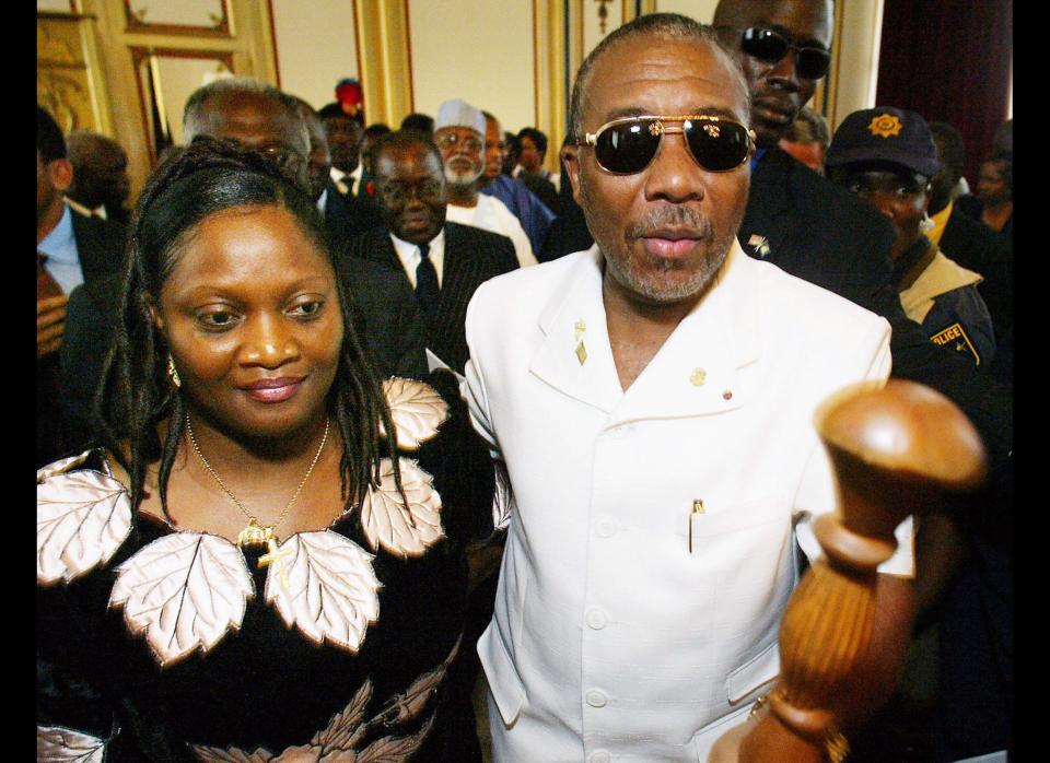 <em>In this Aug. 11, 2003 file photo, Liberian ex-President Charles Taylor, carrying his staff, leaves with wife Jewel Howard-Taylor after officially handing over the power of the presidency to his Vice President Moses Blah, at the Executive Mansion in the Liberian capital Monrovia. (AP Photo/Ben Curtis, File)</em><br><br>    The former Liberian President fired his legal team and boycotted the start of a trial at the Special Court for Sierra Leone in June 2007, claiming he did not have the resources to properly defend himself. The trial got under way again in January 2008 when the first witness testified. Taylor was convicted last month of aiding and abetting murderous rebels in Sierra Leone's civil war. He will be sentenced May 30.