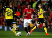 Soccer Football - Carabao Cup Third Round - Manchester United vs Burton Albion - Old Trafford, Manchester, Britain - September 20, 2017 Manchester United's Anthony Martial in action with Burton Albion's Tom Naylor REUTERS/Andrew Yates