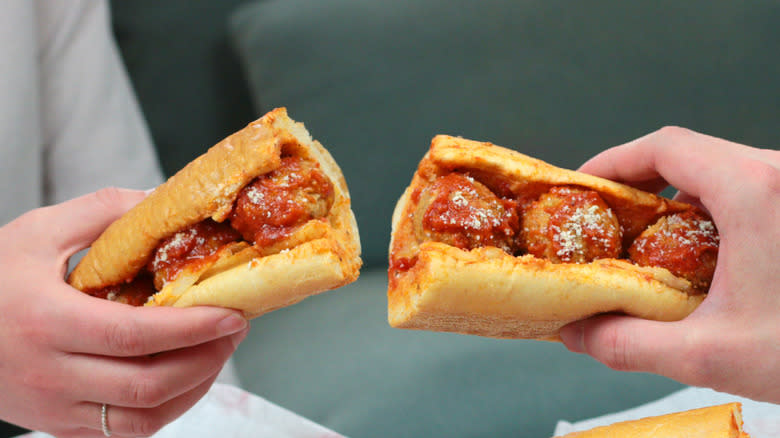 two halves of meatball subs