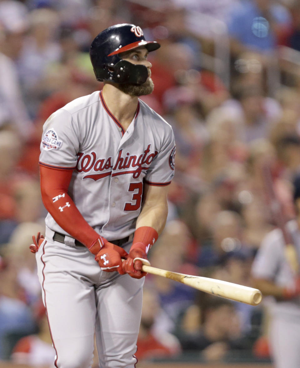 Washington Nationals' Bryce Harper (34) watches his home run in the fourth inning of a baseball game against the St. Louis Cardinals, Monday, Aug. 13, 2018, in St. Louis. (AP Photo/Tom Gannam)