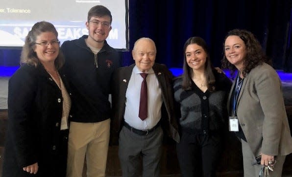 Holocaust survivor Sami Steigmann (center) poses for a picture with (left to right) Westfield High School Social Studies teacher Kimberly Leegan, students Eric Harnisher and Remy Waldman, and Principal Mary Asfendis.