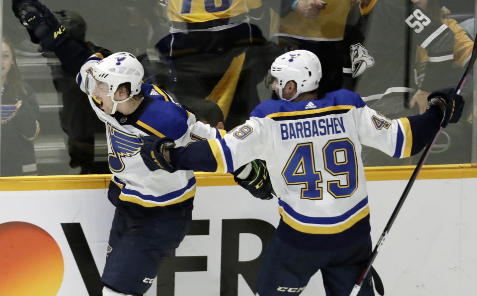 St. Louis Blues right wing Vladimir Tarasenko, of Russia, left, celebrates with Ivan Barbashev (49), of Russia, after Tarasenko scored the winning goal in overtime against the Nashville Predators in an NHL hockey game Sunday, Feb. 10, 2019, in Nashville, Tenn. The Blues won in overtime 5-4. (AP Photo/Mark Humphrey)