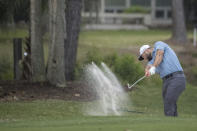 Jon Rahm, of Spain, hits out of a bunker on the sixth fairway during the first round of the RBC Heritage golf tournament, Thursday, April 13, 2023, in Hilton Head Island, S.C. (AP Photo/Stephen B. Morton)