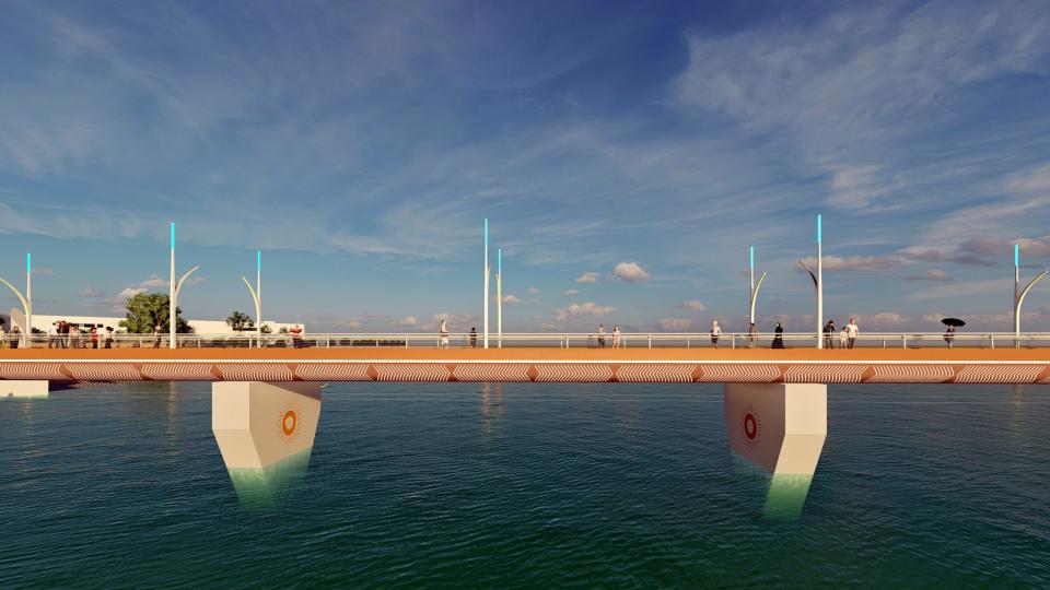 A basic pedestrian bridge is set to be built over the Oklahoma River connecting OKANA with the Boathouse District and Riversport Adventures is shown in this rendering. LED lighting and banner poles were removed due to budget constraints. TEIM Design