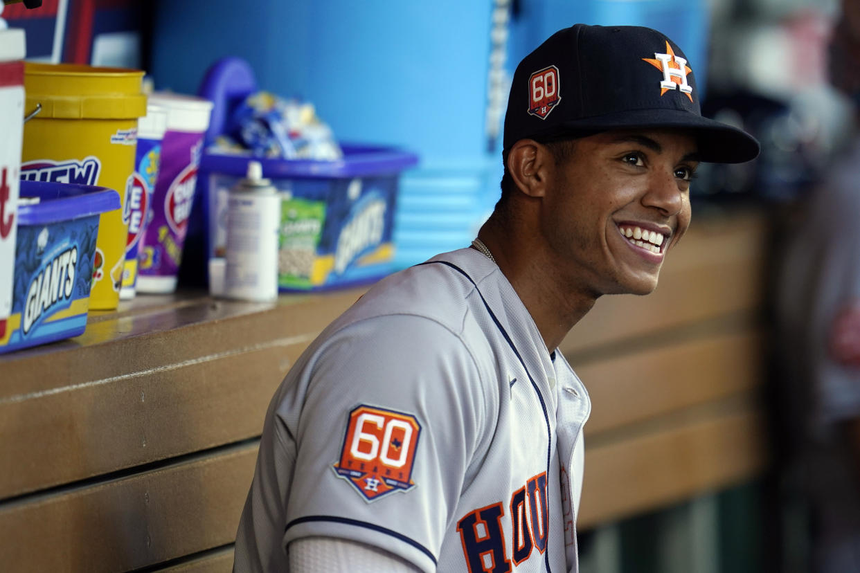 Houston Astros shortstop Jeremy Pena smiles in the dugout before the team's baseball game against the Los Angeles Angels on Friday, April 8, 2022, in Anaheim, Calif. (AP Photo/Marcio Jose Sanchez)