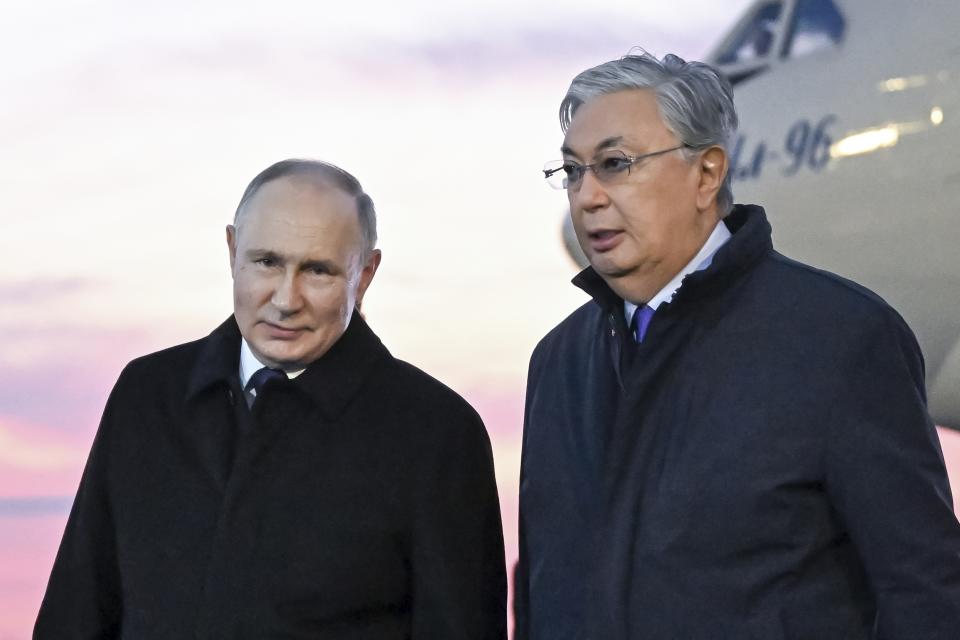 Russian President Vladimir Putin, left, poses for a photo with Kazakhstan's President Kassym-Jomart Tokayev upon his arrival at the International airport outside Astana, Kazakhstan, Thursday, Nov. 9, 2023. (Pavel Bednyakov, Sputnik, Kremlin Pool Photo via AP)