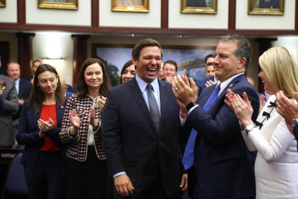 Florida Gov.-elect Ron DeSantis, center, laughs when he is acknowledged in the Florida House on Tuesday, Nov. 20, 2018, with other incoming members of the Florida Cabinet. From left, Agricultural Commissioner-elect Nikki Fried and Attorney General-elect Ashley Moody, Chief Financial Officer Jimmy Patronis and outgoing Attorney General Pam Bondi.