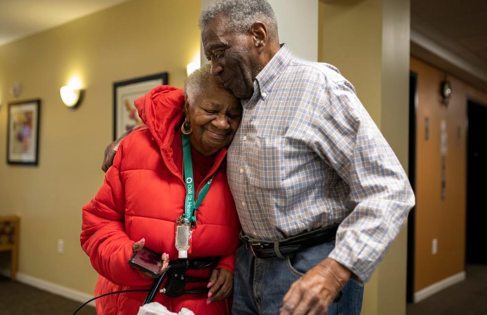 Frances Lewis, 87, a Detroit native, hugs her longtime boyfriend, Willie B. Moultrie, inside the lobby of Moultrie's home in Detroit on Wednesday, Jan. 31, 2024.