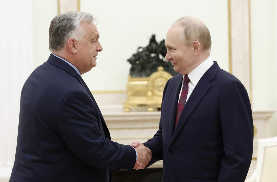 Russian President Vladimir Putin, right, and Hungarian Prime Minister Viktor Orban shake hands during a meeting in Moscow, Russia, Friday, July 5, 2024. (Valeriy Sharifulin, Sputnik, Kremlin Pool Photo via AP)