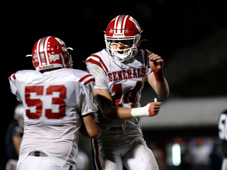 Sheridan senior Reid Packer celebrates with classmate Bryden Gladstone, left, after his interception in the final minute secured an 18-13 win against host Morgan on Friday night at the Morgan Athletic Field. The Generals improved to 3-1 overall. 