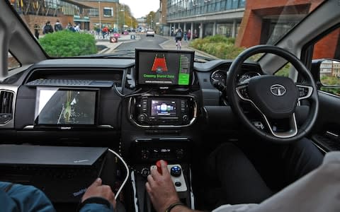 Self-driving car interior - Credit: PA