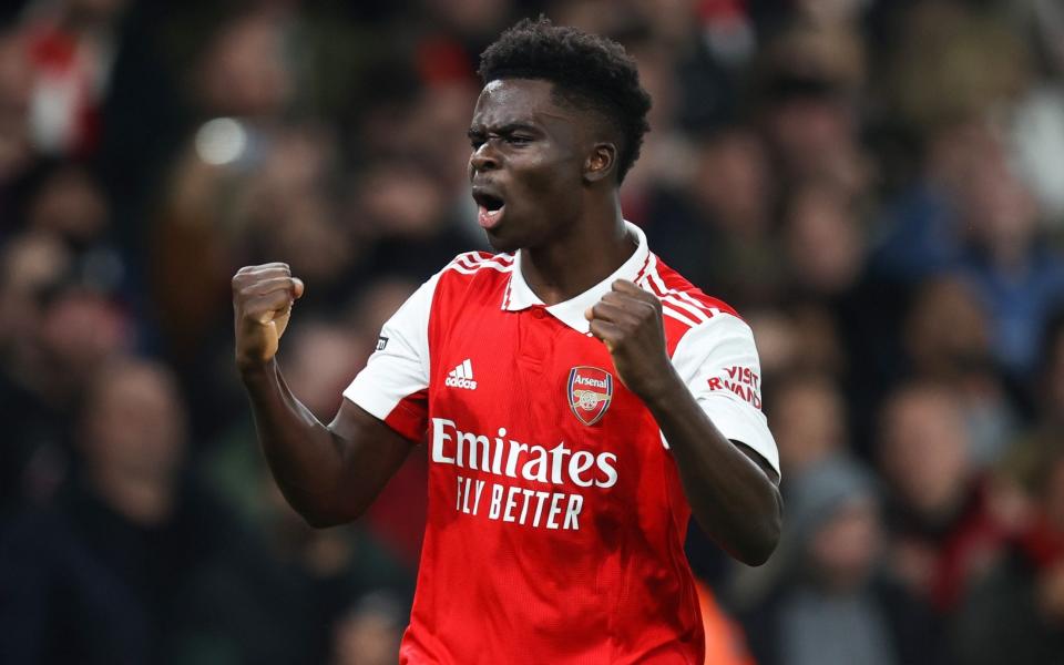 Bukayo Saka of Arsenal celebrates their first goal during the Premier League match between Arsenal FC and Manchester City at Emirates Stadium on February 15, 2023 in London, United Kingdom. - Charlotte Wilson/Offside