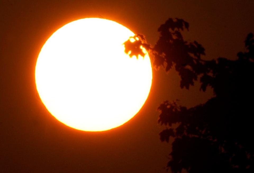 The rising sun in Bayside is obscured by haze due to the Canadian wildfires on Wednesday, June 28, 2023. The quality of Wisconsin's unhealthy air continues from fires.