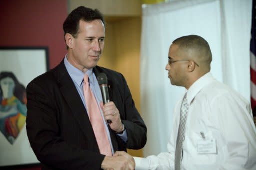 Presidential candidate Rick Santorum shakes hands during a town hall meeting with veterans at the 304 Grill in the financial district March 14, in Old San Juan, Puerto Rico. The island off the US mainland has only 20 delegates at stake for the Republican National Convention in August but has been courted vigorously by the Republican contenders