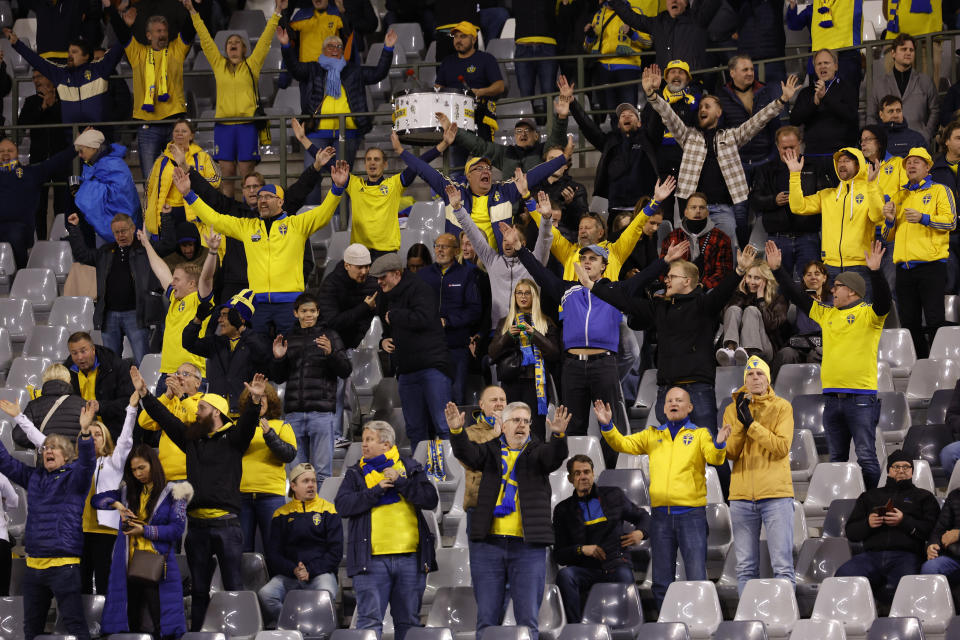 Sweden supporters are on the stands after suspension of the Euro 2024 group F qualifying soccer match between Belgium and Sweden at the King Baudouin Stadium in Brussels, Monday, Oct. 16, 2023. The match was abandoned at halftime after two Swedes were killed in a shooting in central Brussels before kickoff. (AP Photo/Geert Vanden Wijngaert)