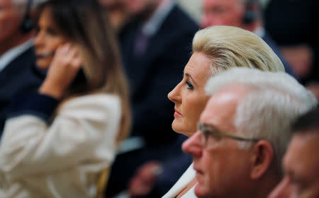 Poland's President Andrzej Duda's wife Agata Kornhauser-Duda (R) listens as she sits across from U.S. first lady Melania Trump during a joint news conference between U.S. President Donald Trump and President Duda in the East Room of the White House in Washington, U.S., September 18, 2018. REUTERS/Brian Snyder
