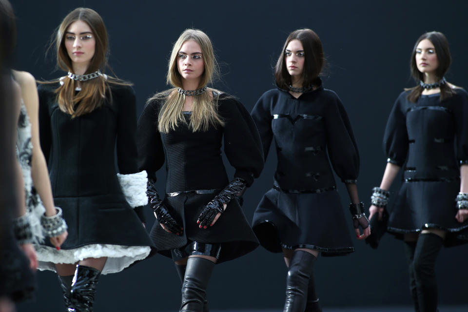 Models wear creations by German fashion designer Karl Lagerfeld for Chanel's Fall/Winter 2013-2014 ready to wear collection, in Paris, Tuesday, March, 5, 2013. (AP Photo/Thibault Camus)