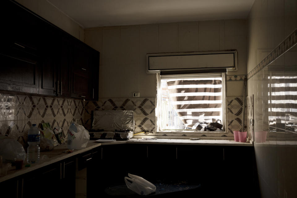 The kitchen has been emptied at the family apartment of Mohammed Zalabani, a 13 year-old Palestinian in juvenile detention, awaiting trial on murder charges for a Feb. 13 stabbing attack, ahead of its demolition by Israeli authorities in Shuafat refugee camp in east Jerusalem, Wednesday, Aug. 30, 2023. An Israeli court last week dismissed the family's appeal and decided to destroy their home of nearly three years in Shuafat refugee camp, a crowded and garbage-strewn district of east Jerusalem, as further punishment. The demolition could occur anytime in the coming days. (AP Photo/Maya Alleruzzo)