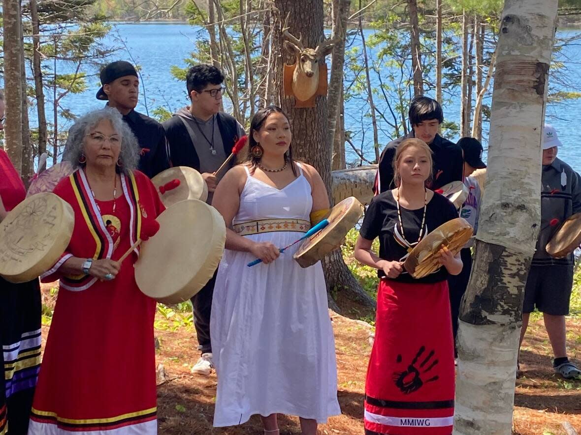 Lorraine Whitman, president of the National Women's Association of Canada, left, Kalolin Johnson, centre, and Deedee Austin, right, take part in a music video filmed in Eskasoni First Nation.  (submitted by Arnold Sylliboy  - image credit)