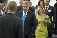 Hungary's Prime Minister Viktor Orban, center, arrives to deliver his speech at the European Parliament in Strasbourg, eastern France, Tuesday Sept.11, 2018. The European Parliament debates whether Hungary should face political sanctions for policies that opponents say are against the EU's democratic values and the rule of law. (AP Photo/Jean-Francois Badias)