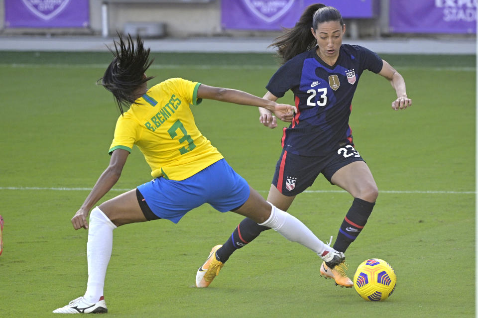 United States forward Christen Press (23) controls a ball in front of Brazil defender Bruna (3) during the second half of a SheBelieves Cup women's soccer match, Sunday, Feb. 21, 2021, in Orlando, Fla. (AP Photo/Phelan M. Ebenhack)