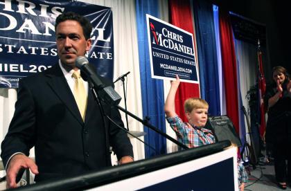 Chris McDaniel addresses his supporters as his son Cambridge, 7, joins him on the stage Tuesday June 3, 2014, at the Lake Terrace Convention Center in Hattiesburg, Miss. It could be days or weeks before the results of the Mississippi Republican Senate primary between six-term incumbent Thad Cochran and McDaniel. The race was too close to call on election night Tuesday. With a third candidate on the ballot, neither Cochran nor McDaniel managed to get at least 50 percent plus one vote, the threshold to win outright and avoid a June 24 runoff. (AP Photo/George Clark)