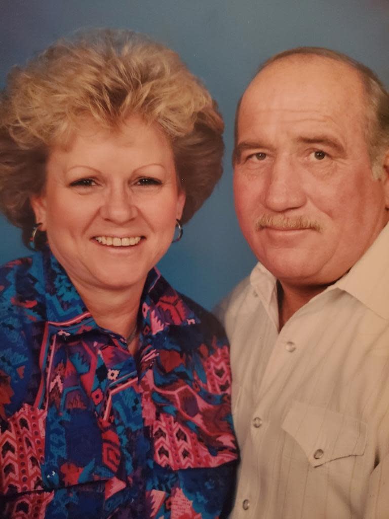 A family photo of a couple posing for a portrait