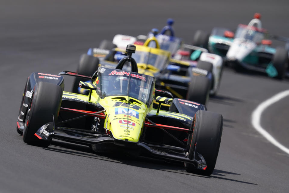 FILE - Santino Ferrucci drives into turn one during the Indianapolis 500 auto race at Indianapolis Motor Speedway in Indianapolis, in this Sunday, Aug. 23, 2020, file photo. Ferrucci has landed a ride for the Indianapolis 500 with Rahal Letterman Lanigan Racing. The team finished first and third in last year's race with Takuma Sato and Graham Rahal, while Ferrucci was fourth. Now RLL will return to Indy with a driver lineup that claimed three of the top four spots a year ago.(AP Photo/Darron Cummings, File)