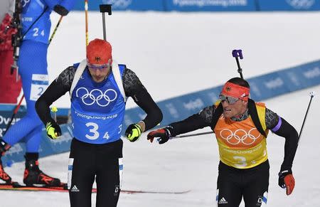 Biathlon - Pyeongchang 2018 Winter Olympics - Mixed Relay Final - Alpensia Biathlon Centre - Pyeongchang, South Korea - February 20, 2018 - Erik Lesser of Germany hands over to Arnd Peiffer of Germany. REUTERS/Toby Melville