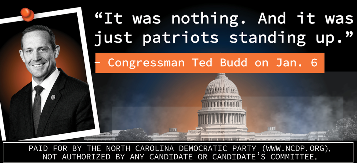 The North Carolina Democratic Party hangs a billboard outside the Wilmington airport to remind voters of Rep. Ted Budd’s comments about the Capitol insurrection ahead of a Trump rally.