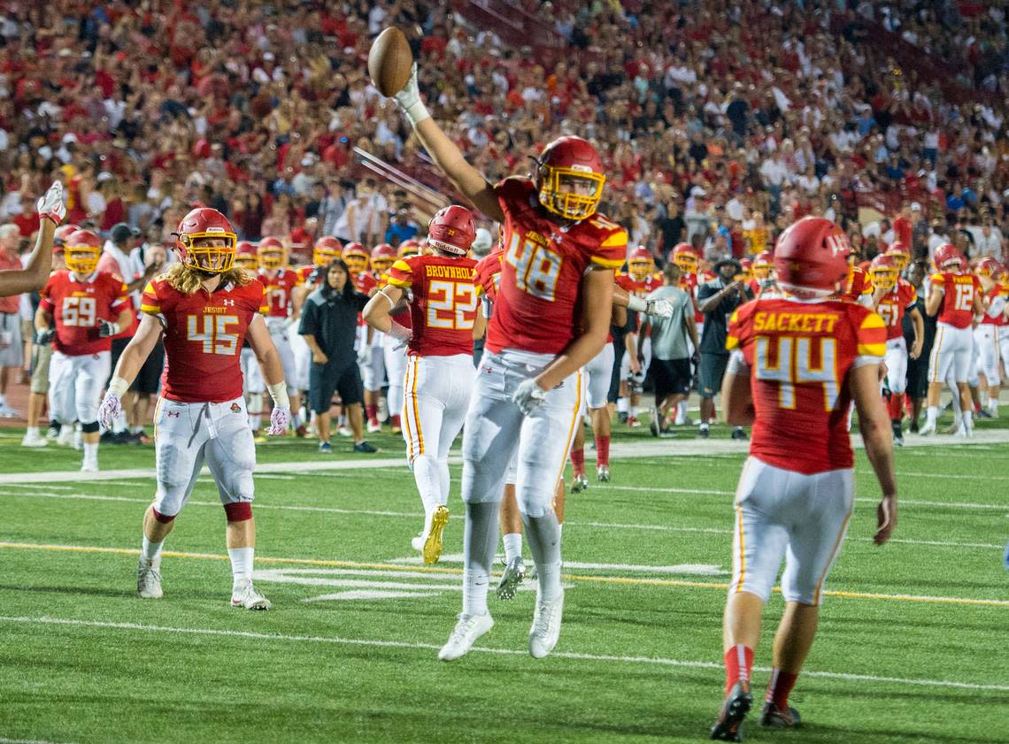 Jesuit’s Laiatu Latu celebrates a fumble recovery that stopped Christian Brothers at the goal line in the Holy Bowl at Hughes Stadium at Sacramento City College in 2017. Brian Baer/Special to The Bee