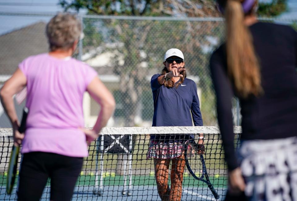 Tennis pro Lisa Zuk leads a tennis clinic at Burton Memorial Park. She had to scramble to find court space after Hurricane Ian damaged the Yacht Club courts.