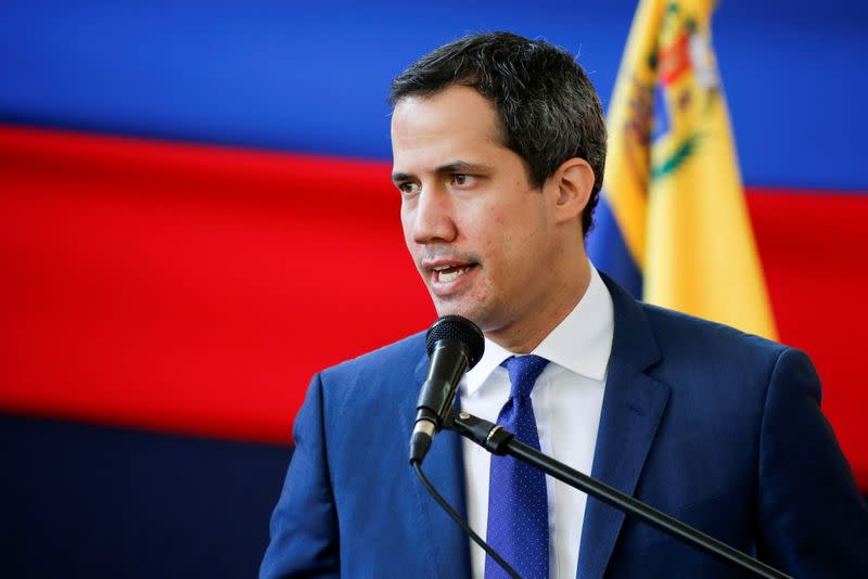 Venezuela's opposition leader Juan Guaido addresses the media the day after regional and local elections, in Caracas