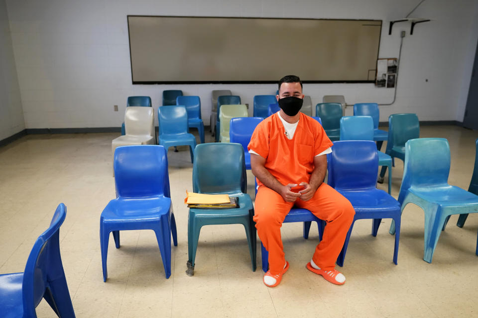 Immigration detainee Alexander Martinez speaks during an interview with The Associated Press inside the Winn Correctional Center in Winnfield, La., Friday, July 30, 2021. Martinez says he fled from homophobia, government persecution and the notorious MS-13 gang in El Salvador only to run into abuse and harassment in America’s immigration detention system. (AP Photo/Gerald Herbert)