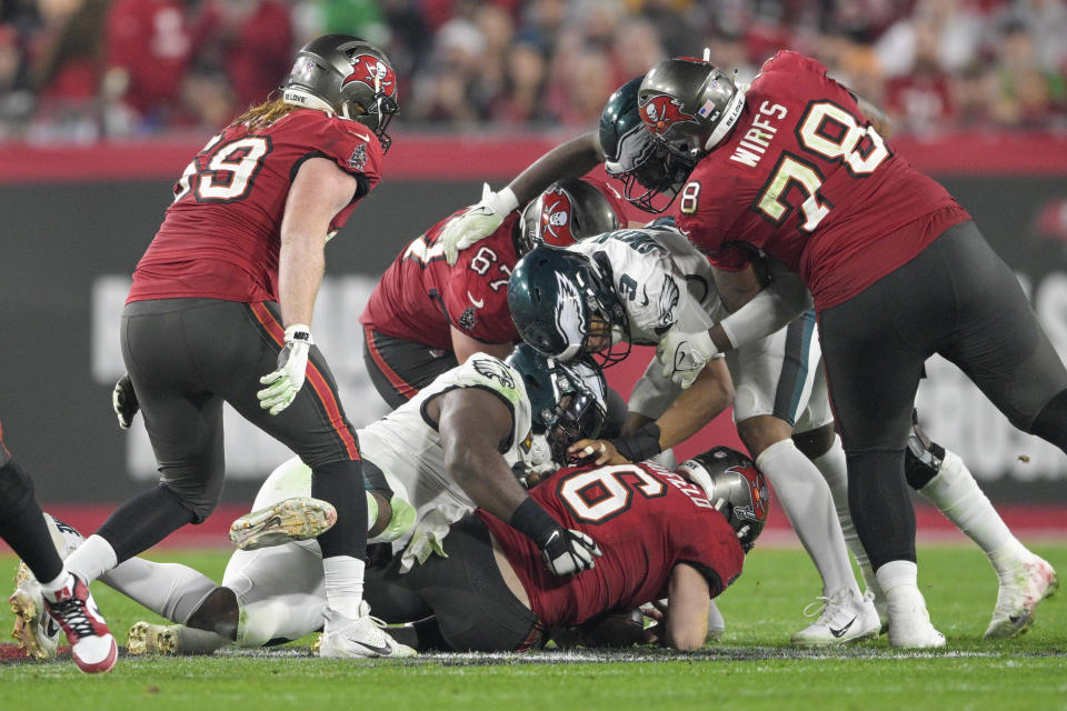 Tampa Bay Buccaneers quarterback Baker Mayfield (6) is sacked by Philadelphia Eagles defensive tackle Fletcher Cox during the second half of an NFL wild-card playoff football game, Monday, Jan. 15, 2024, in Tampa, Fla. (AP Photo/Phelan M. Ebenhack)