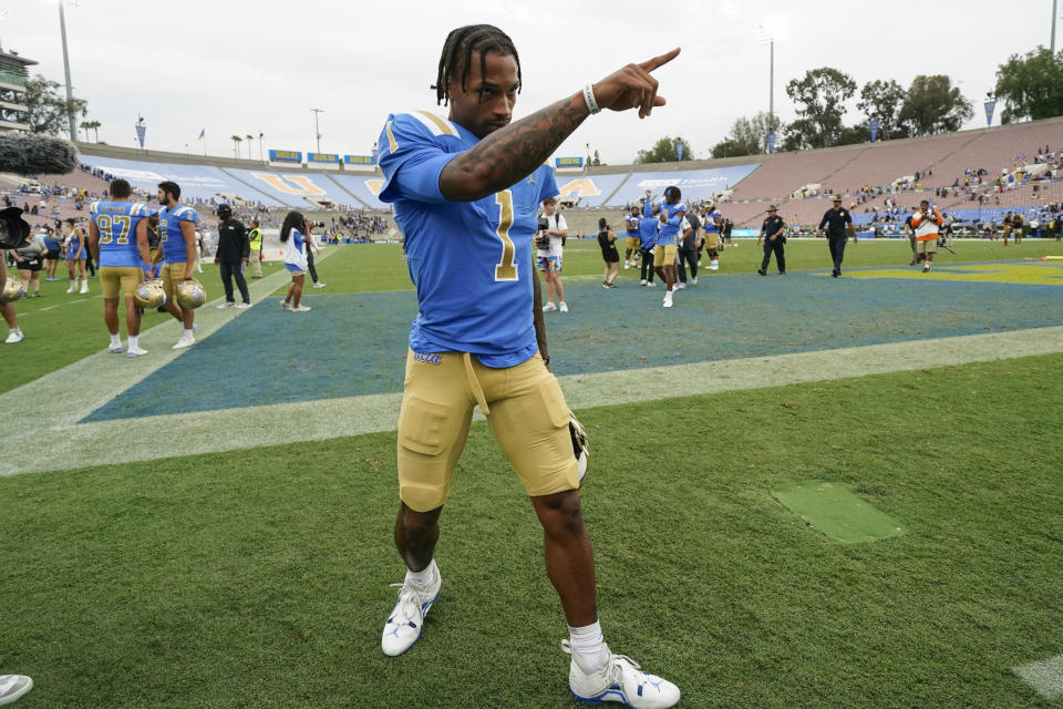 UCLA quarterback Dorian Thompson-Robinson (1) points to a fan after an NCAA college football game against Alabama State in Pasadena, Calif., Saturday, Sept. 10, 2022. UCLA won 45-7. (AP Photo/Ashley Landis)
