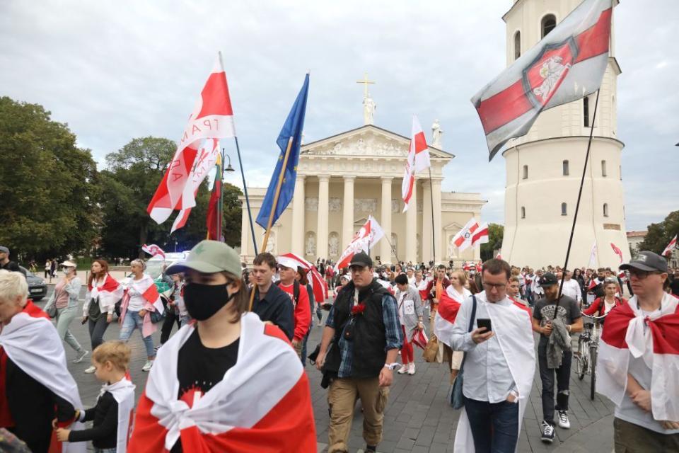 Belarusian people and their supporters, many with historical Belarusian flags, take part in a march in Vilnius on Aug. 9, 2023. (Petras Malukas/AFP via Getty Images)