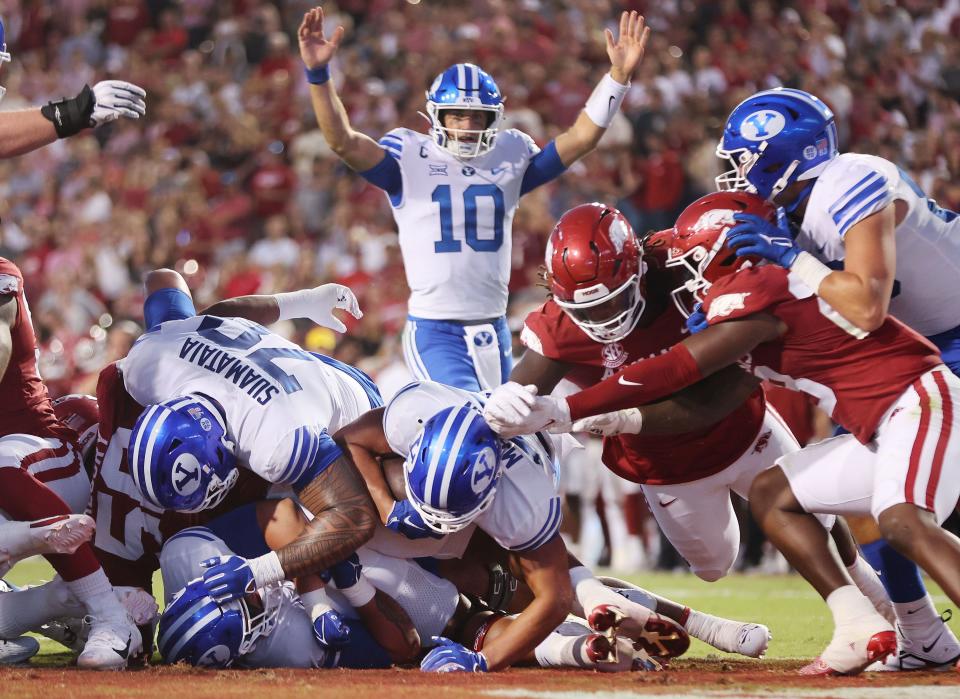 Brigham Young Cougars running back LJ Martin (27) scores against the Arkansas Razorbacks at Razorback Stadium in Fayetteville on Saturday, Sept. 16, 2023. | Jeffrey D. Allred, Deseret News