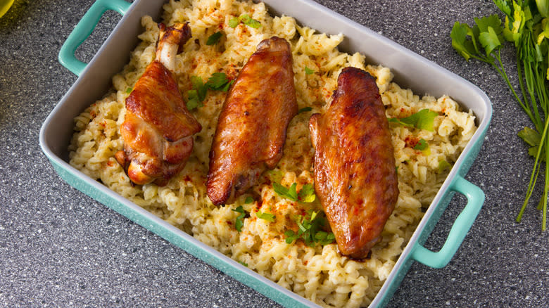 Cooked turkey wings over pasta