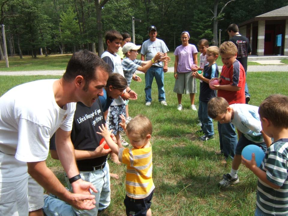 Detroit neurosurgeon Devon Hoover, left, photographed with his nieces and nephews during a family camping trip in 2006.