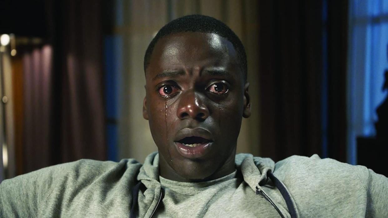 a close up of a crying chris from get out a good housekeeping pick for best halloween movies