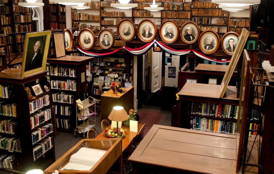 The cozy and historic Library Company of Burlington, chartered by England in 1757 for Burlington City. Portraits of early U.S. presidents and early library board members adorn the mezzanine's wrought iron railing.