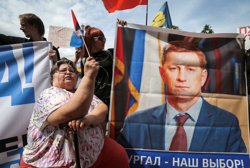 People take part in a rally in support of arrested governor Sergei Furgal in Khabarovsk