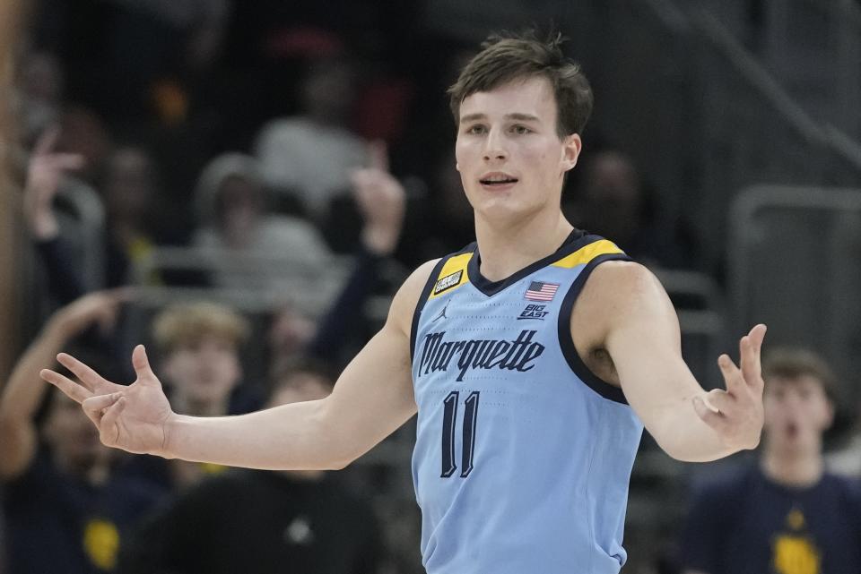 Marquette's Tyler Kolek reacts after his three pointer during the first half of an NCAA college basketball game against Texas Wednesday, Dec. 6, 2023, in Milwaukee. (AP Photo/Morry Gash)