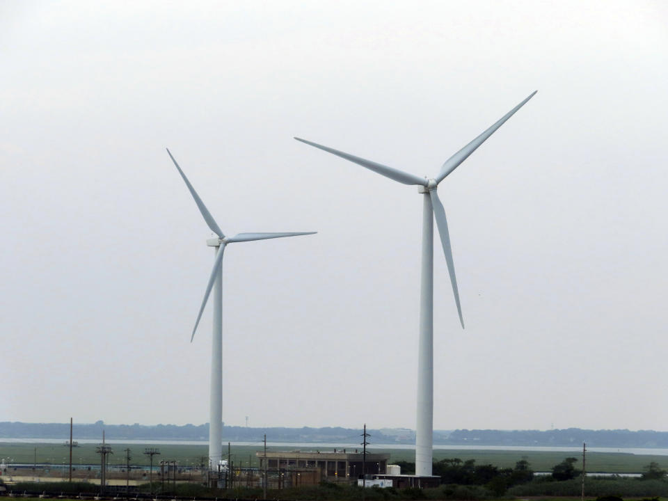 FILE - Land-based wind turbines in Atlantic City, N.J., turn on July 20, 2023. Two major offshore wind power projects are taking steps forward in New Jersey as the owners of one project agreed to bring the federal government in on their environmental monitoring plans at an earlier stage than has ever been done, and federal regulators said plans for another project are not expected to kill or seriously injure marine life. They come as New Jersey continues to grow as a hub of opposition to offshore wind projects from residents' groups and their political allies, mostly Republicans (AP Photo/Wayne Parry, File)