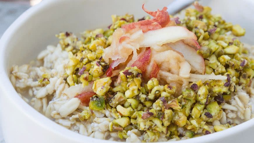 <p>Coconut and pear bircher oats with grated apple and crushed pistachios from eatrealfoodnyc.com. Photo: Morgan Ione Yeager.</p>