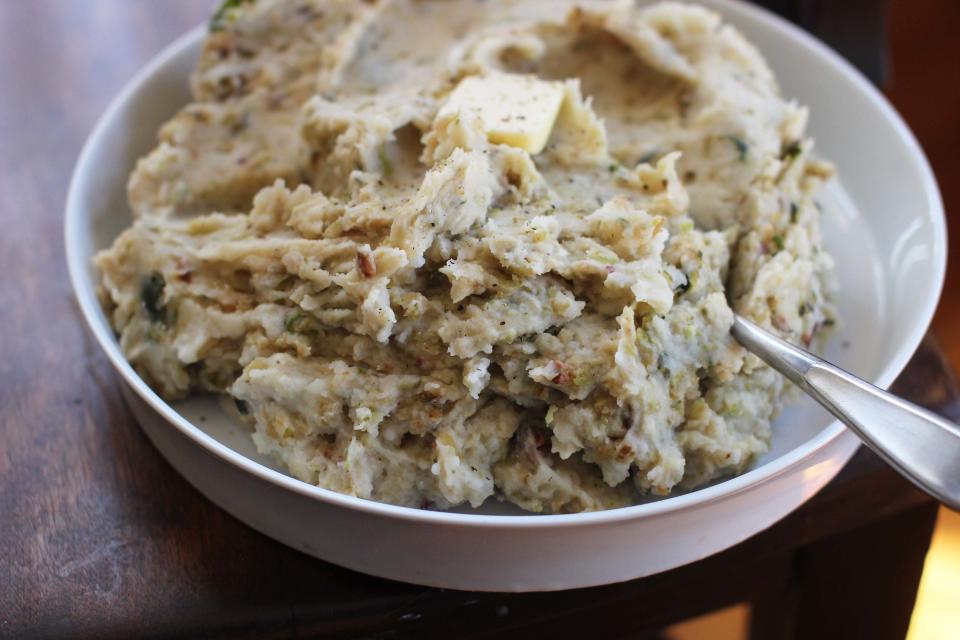 This Nov. 2, 2015, photo, shows mashed potato with Brussels sprouts in Concord, N.H. Whatever the kitchen disaster, there’s usually an easy fix available, including mashed potatoes that are lumpy. (AP Photo/Matthew Mead)