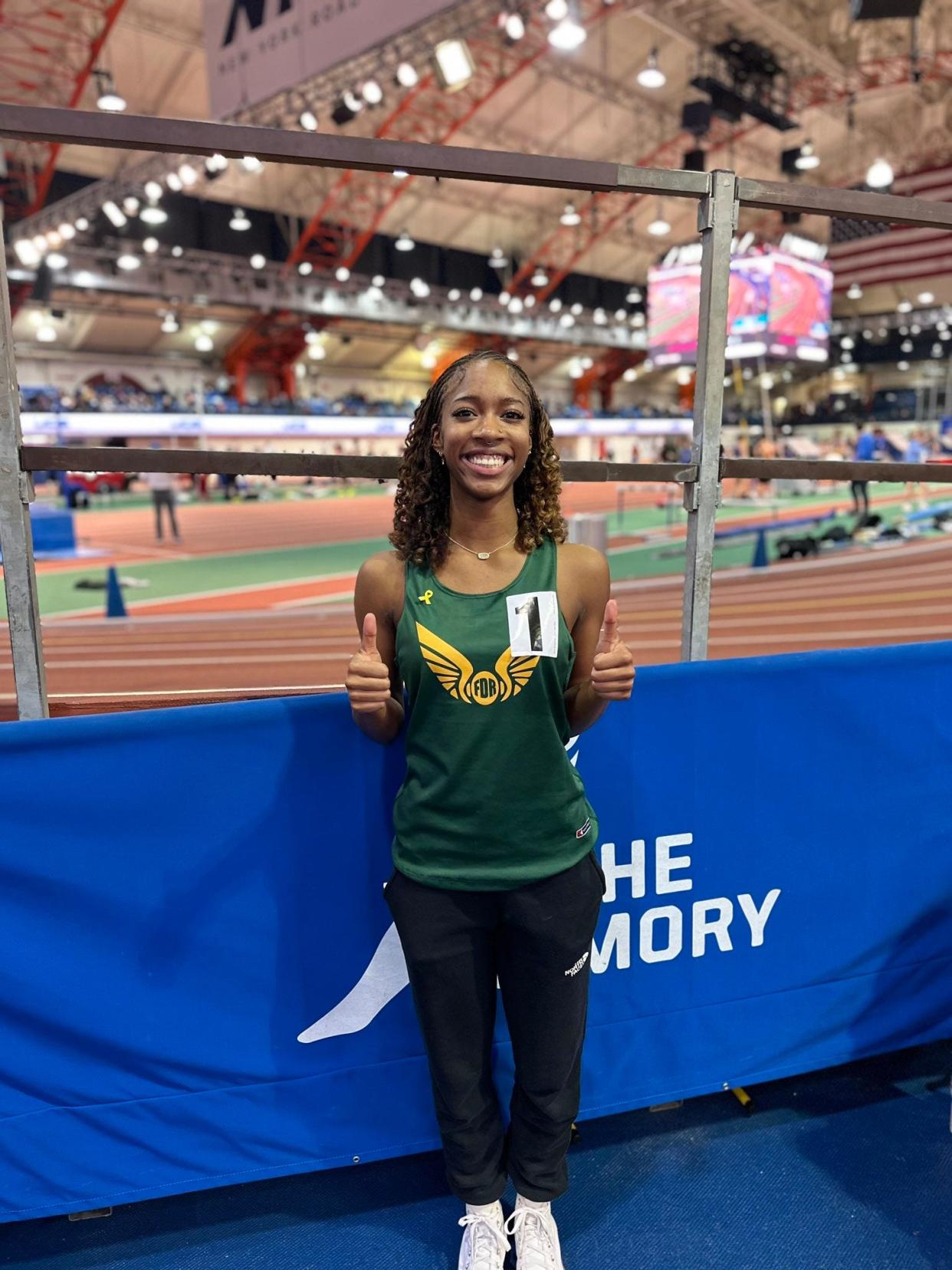 Roosevelt's Jordyn Jones poses after breaking her own program record in the long jump at the Section 9 Holiday Classic at The Armory on Dec. 23, 2023.