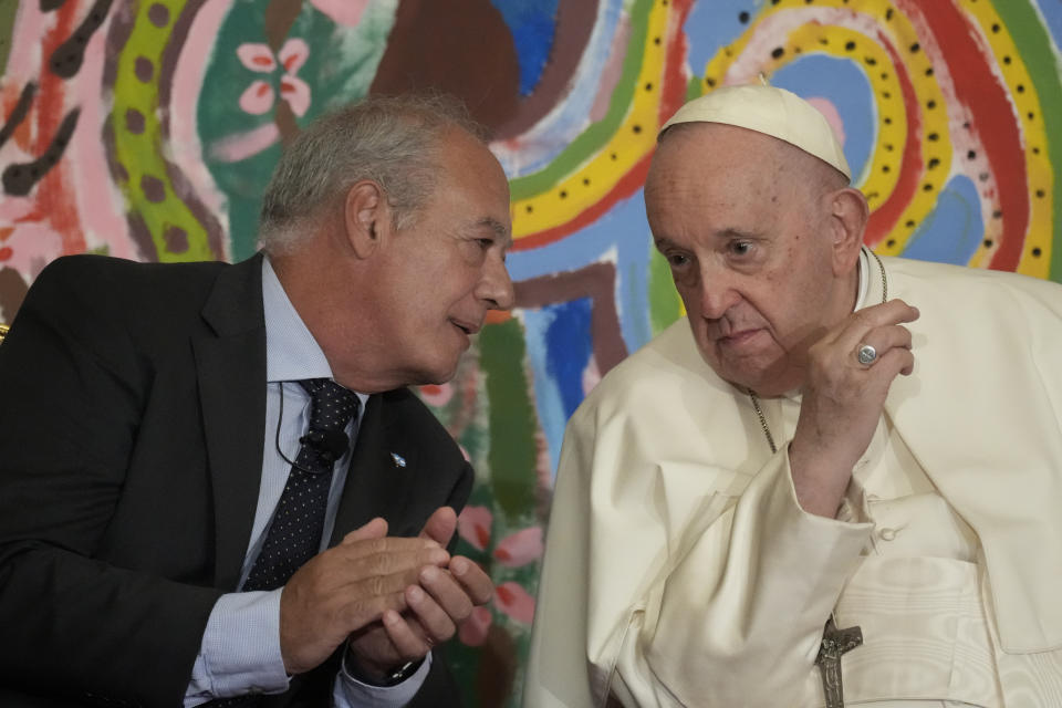 Pope Francis talks with José María del Corral, president of Scholas Occurrentes as they attend the world's first meeting of the 'Educational Eco-Cities' promoted by the 'Scholas Occurrentes', at the Vatican, Thursday, May 25, 2023. (AP Photo/Andrew Medichini)