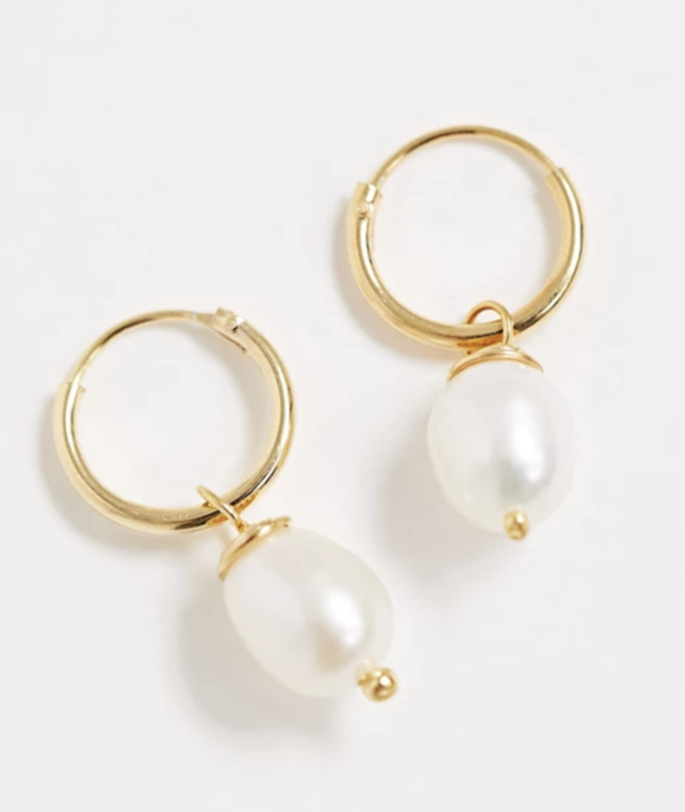 Sterling Silver with Gold Plate Hoop Earrings with Pearl Charm. Image via ASOS.
